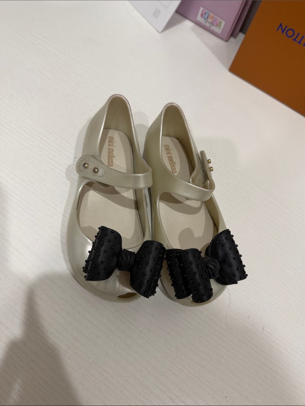Mini Melissa Pearl Cream Mary Jane Shoes with Black Bows